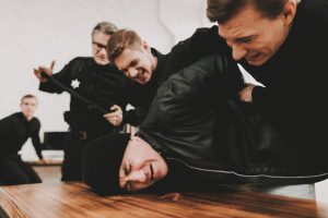 Police,Officers,Are,Delivering,Detainee,On,Questioning.,Arrest,Resist.,Work