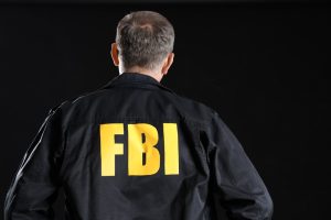 Mature,Fbi,Agent,On,Black,Background,,Back,View