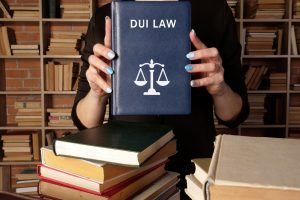 Lawyer,Holds,Dui,Law,Book.,Among,Other,Names,,The,Criminal