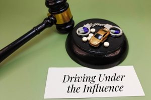 Driving,Under,The,Influence,Written,On,Paper,With,Capsules,,Handcuffs,