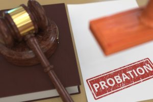 Wooden,Gavel,And,Probation,Stamp,On,The,Paper.,Court,Related