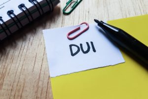 Dui,Writting,On,Table,Background.