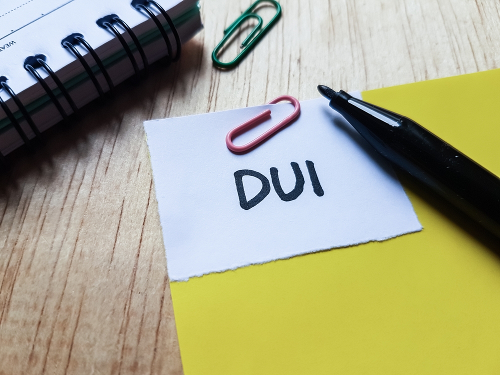 Dui,Writting,On,Table,Background.