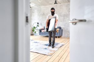 Masked,Face.,Man,Burglar,Stealing,Tv,Set,From,House.,Thief