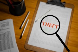 3d,Rendered,"theft",In,Bold,Red,Text,Under,A,Magnifying