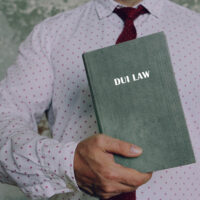 JuristHoldsDuiLawBookAmongOtherNamesTheCriminal