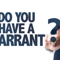 BusinessManPointingTheTextDoYouHaveAWarrant