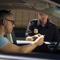 Our Chicago criminal defense attorney at Edward Johnson & Associates P.C. answers, Do You Have To Answer Police Questions During A Traffic Stop In Illinois?